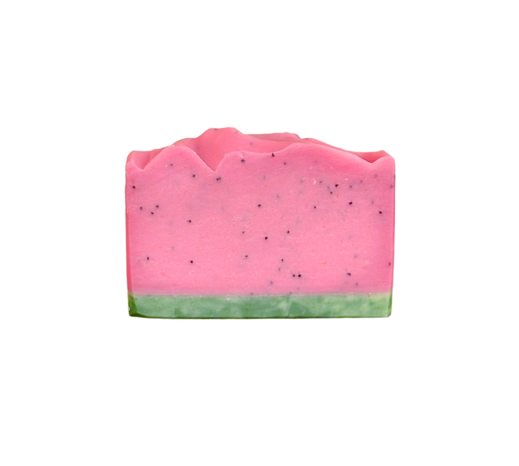 Watermelon soap bar with spreckles on a wood surface
